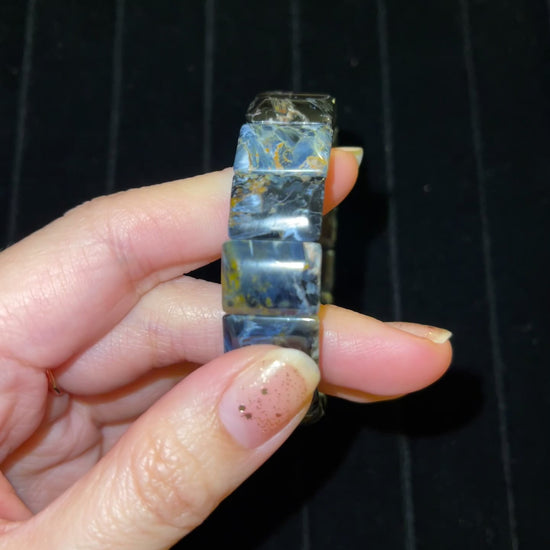 video closeup of Petersite bracelet